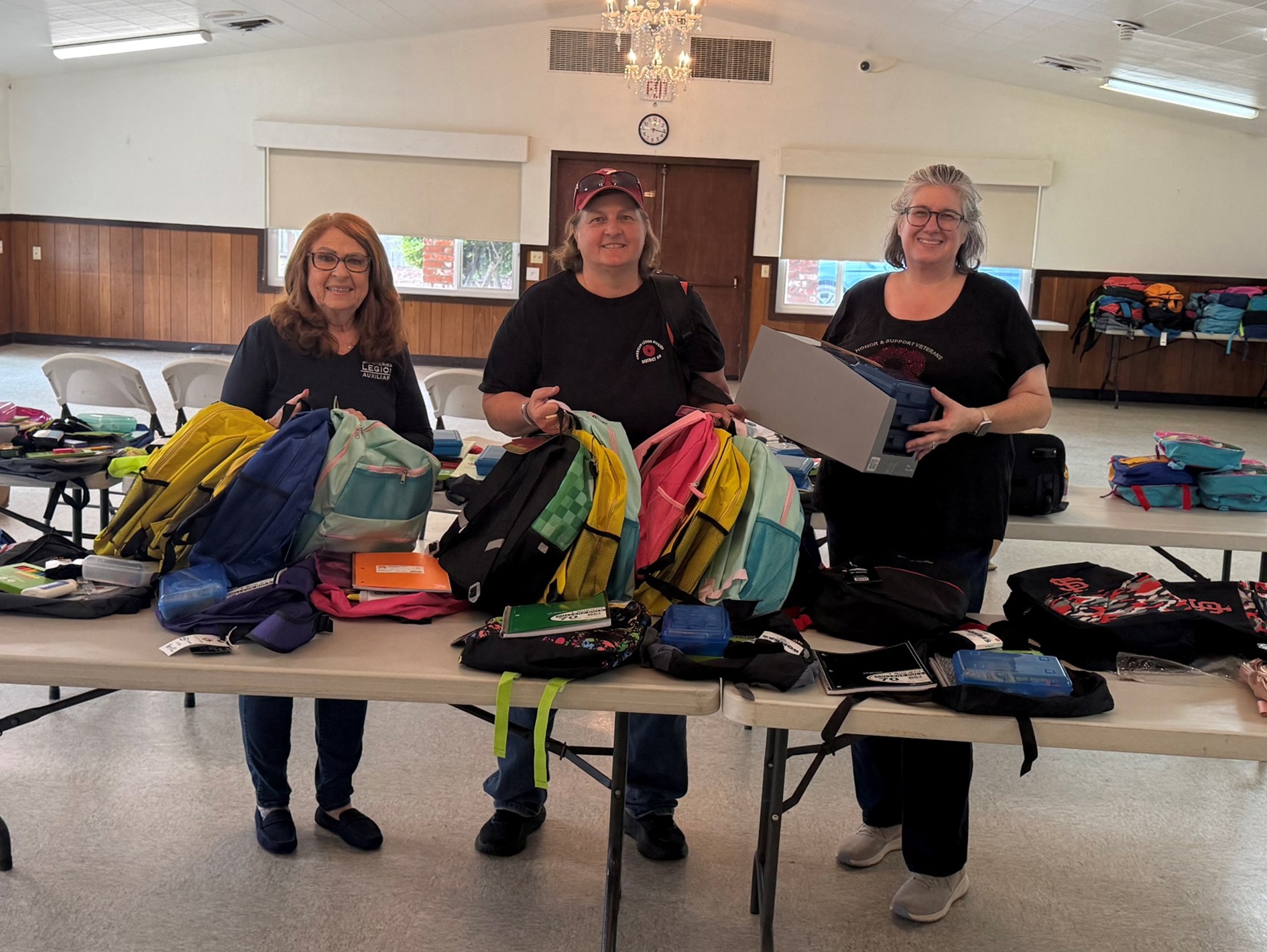 Members holding bookbags